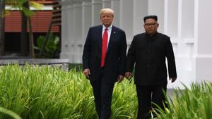 North Korea's leader Kim Jong Un with US President Donald Trump during a break in talks at their historic US-North Korea summit, at the Capella Hotel on Sentosa island in Singapore on June 12, 2018.(AFP) North Korea's leader Kim Jong Un with US President Donald Trump during a break in talks at their historic US-North Korea summit, at the Capella Hotel on Sentosa island in Singapore on June 12, 2018.(AFP)