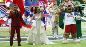 Robbie Williams, left, and Aida Garifullina, center, perform ahead of the group A match between Russia and Saudi Arabia which opens the FIFA World Cup 2018 at the Luzhniki Stadium in Moscow on Thursday.(AP) Robbie Williams, left, and Aida Garifullina, center, perform ahead of the group A match between Russia and Saudi Arabia which opens the FIFA World Cup 2018 at the Luzhniki Stadium in Moscow on Thursday.(AP)