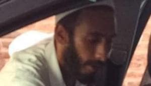 The police issued the picture from a video, which was purportedly recorded by a passerby following the attack on Bukhari outside his office, showing a bearded man surveying the inside of the journalist’s vehicle.(ANI/Twitter) The police issued the picture from a video, which was purportedly recorded by a passerby following the attack on Bukhari outside his office, showing a bearded man surveying the inside of the journalist’s vehicle.(ANI/Twitter)