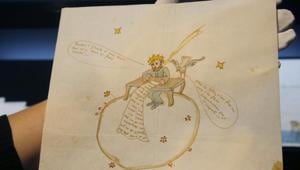 The illustration showing a likeness of Saint-Exupery's renowned Little Prince atop a globe, adorning an anguished love letter, has sold at auction for 240,500 euros.(AP) The illustration showing a likeness of Saint-Exupery's renowned Little Prince atop a globe, adorning an anguished love letter, has sold at auction for 240,500 euros.(AP)