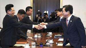 In this photo provided by the South Korea Culture And Sports Ministry, South Korean head delegate Jeon Choong-ryul (right) shakes hands with his North Korean counterpart Won Kil U during a meeting at the southern side of Panmunjom in the Demilitarized Zone, North Korea, on June 18, 2018.(AP) In this photo provided by the South Korea Culture And Sports Ministry, South Korean head delegate Jeon Choong-ryul (right) shakes hands with his North Korean counterpart Won Kil U during a meeting at the southern side of Panmunjom in the Demilitarized Zone, North Korea, on June 18, 2018.(AP)