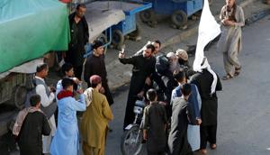 People take selfies with the Taliban in Kabul, Afghanistan June 16, 2018.(REUTERS) People take selfies with the Taliban in Kabul, Afghanistan June 16, 2018.(REUTERS)
