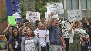 People protest the policy of separating families at the border outside the Ernest N Morial Convention Center in New Orleans where Attorney General Jeff Sessions was addressing the National Sheriffs' Association on June 18, 2018.(AP) People protest the policy of separating families at the border outside the Ernest N Morial Convention Center in New Orleans where Attorney General Jeff Sessions was addressing the National Sheriffs' Association on June 18, 2018.(AP)