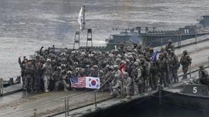 In this December 10, 2015 file photo, US and South Korean army soldiers pose on a floating bridge on the Hantan river after a river crossing operation in Yeoncheon, south of the demilitarized zone that divides the two Koreas, South Korea.(AP) In this December 10, 2015 file photo, US and South Korean army soldiers pose on a floating bridge on the Hantan river after a river crossing operation in Yeoncheon, south of the demilitarized zone that divides the two Koreas, South Korea.(AP)
