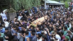 Kashmiris carry the body of Hizbul Mujahideen commander Burhan Wani during his funeral procession in Tral on July 9, 2016. The killing of Wani, considered a hero among locals, sparked months of unrest in the Valley, pitting civilians against security forces and leading to scores of deaths and dozens more injured.(Waseem Andrabi/ HT File Photo) Kashmiris carry the body of Hizbul Mujahideen commander Burhan Wani during his funeral procession in Tral on July 9, 2016. The killing of Wani, considered a hero among locals, sparked months of unrest in the Valley, pitting civilians against security forces and leading to scores of deaths and dozens more injured.(Waseem Andrabi/ HT File Photo)