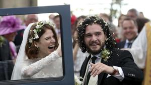 Actors Kit Harington and Rose Leslie react as they leave after their wedding ceremony at Rayne Church, Scotland on Saturday.(AP) Actors Kit Harington and Rose Leslie react as they leave after their wedding ceremony at Rayne Church, Scotland on Saturday.(AP)