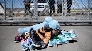 A file photo shows security personal standing before shoes and toys left at the Tornillo Port of Entry in Tornillo, Texas on June 21 where minors crossing the border without proper papers have been housed after being separated from adults(AFP File Photo) A file photo shows security personal standing before shoes and toys left at the Tornillo Port of Entry in Tornillo, Texas on June 21 where minors crossing the border without proper papers have been housed after being separated from adults(AFP File Photo)