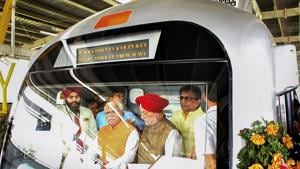 Haryana chief minister Manohar Lal Khattar and Union urban affairs minister Hardeep Puri in the cockpit of a metro train after the inauguration of the Mundka-Bahadurgarh section of the Delhi Metro's Green Line by Prime Minister Narendra Modi via videoconference, in Bahadurgarh.(PTI Photo)
