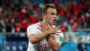 Xherdan Shaqiri and Granit Xhaka of Switzerland celebrated with a double-eagle gesture with their hands to represent the Albanian flag during the FIFA World Cup 2018 game against Serbia and that has landed them in trouble with FIFA.(Getty Images) Xherdan Shaqiri and Granit Xhaka of Switzerland celebrated with a double-eagle gesture with their hands to represent the Albanian flag during the FIFA World Cup 2018 game against Serbia and that has landed them in trouble with FIFA.(Getty Images)