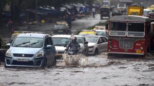 Mumbai rains: Vehicles wade through water-logged tracks during heavy rains, in Mumbai on Monday, June 25, 2018.(PTI)