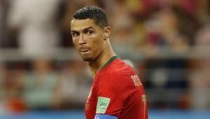 Portugal will face Uruguay in the last 16 of FIFA World Cup 2018 after advancing as runners-up of Group B, but Carlos Queiroz insisted Ronaldo deserved to be sent off for catching Iran defender Morteza Pouraliganji with an elbow to the face.(AP) Portugal will face Uruguay in the last 16 of FIFA World Cup 2018 after advancing as runners-up of Group B, but Carlos Queiroz insisted Ronaldo deserved to be sent off for catching Iran defender Morteza Pouraliganji with an elbow to the face.(AP)