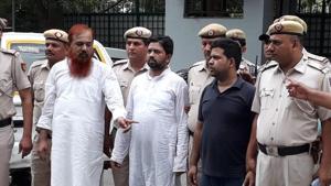 Sajid Ali (in T-shirt) sought help from his brothers Hasmat Ali Ansari and Mohammad Ishtiaq (left) to dispose of the body of his wife.(Sourced)