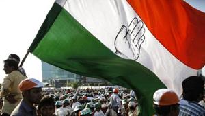 File photo of a Congress supporter holding a huge flag an election campaign rally in Mumbai.(Reuters) File photo of a Congress supporter holding a huge flag an election campaign rally in Mumbai.(Reuters)