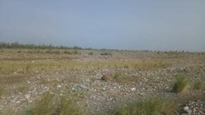 It was estimated that around three lakh cubic metres of riverbed material such as sand, gravel, stones and debris has accumulated on the banks of the Gola river.(HT Photo) It was estimated that around three lakh cubic metres of riverbed material such as sand, gravel, stones and debris has accumulated on the banks of the Gola river.(HT Photo)