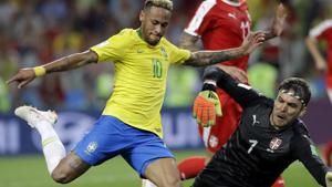 Brazil's Neymar, left, attempts to shoot past Serbia goalkeeper Vladimir Stojkovic during the group E match between Serbia and Brazil.(AP) Brazil's Neymar, left, attempts to shoot past Serbia goalkeeper Vladimir Stojkovic during the group E match between Serbia and Brazil.(AP)