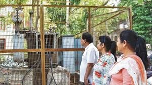 Sushant Lok residents seen standing near a power transformer. They had to spend night without electricity as power cuts emerge as big menace with soaring humidity and increasing consumption demand, in Gurugram on Thursday Sushant Lok residents seen standing near a power transformer. They had to spend night without electricity as power cuts emerge as big menace with soaring humidity and increasing consumption demand, in Gurugram on Thursday