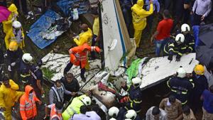 Forensic team, firefighters and dog squad at the chartered plane crash site inspecting the wreckage of Beechcraft King Air C90 turboprop at Old Malik Estate, Jeev Daya Lane, in Ghatkopar (west) in Mumbai on Thursday.(Vijayanand Gupta/HT Photo) Forensic team, firefighters and dog squad at the chartered plane crash site inspecting the wreckage of Beechcraft King Air C90 turboprop at Old Malik Estate, Jeev Daya Lane, in Ghatkopar (west) in Mumbai on Thursday.(Vijayanand Gupta/HT Photo)