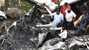 Forensic experts examine the debris of a Beechcraft King Air C90 turboprop aircraft that crashed in Old Malik Estate in Ghatkopar, Mumbai, on June 28, 2018.(Vijayanand Gupta/HT Photo) Forensic experts examine the debris of a Beechcraft King Air C90 turboprop aircraft that crashed in Old Malik Estate in Ghatkopar, Mumbai, on June 28, 2018.(Vijayanand Gupta/HT Photo)