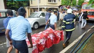 Indian Air Force personnel and a Mumbai Fire personnel carry the body of one of the victims from the site of the chartered plane crash, in Ghatkopar in Mumbai.(PTI Photo) Indian Air Force personnel and a Mumbai Fire personnel carry the body of one of the victims from the site of the chartered plane crash, in Ghatkopar in Mumbai.(PTI Photo)