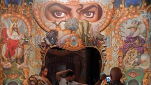 Visitors take photos beside the Detail of the King of Pop by Mark Ryden which forms part of the exhibition.(Reuters) Visitors take photos beside the Detail of the King of Pop by Mark Ryden which forms part of the exhibition.(Reuters)