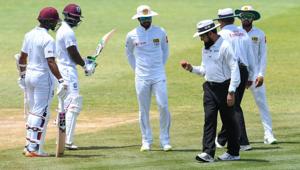 Dinesh Chandimal (C) of Sri Lanka looks at the ball in umpire Aleem Dar's hand while Shai Hope (L) and Devon Smith (2L) of West Indies watch during day 3 of the 2nd Test between West Indies and Sri Lanka at Daren Sammy Cricket Ground, Gros Islet, St. Lucia, on June 16, 2018.(AFP) Dinesh Chandimal (C) of Sri Lanka looks at the ball in umpire Aleem Dar's hand while Shai Hope (L) and Devon Smith (2L) of West Indies watch during day 3 of the 2nd Test between West Indies and Sri Lanka at Daren Sammy Cricket Ground, Gros Islet, St. Lucia, on June 16, 2018.(AFP)