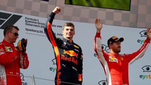 Red Bull’s Max Verstappen celebrates on the podium after winning the race alongside second-placed Ferrari's Kimi Raikkonen and third-place Ferrari's Sebastian Vettel.(REUTERS) Red Bull’s Max Verstappen celebrates on the podium after winning the race alongside second-placed Ferrari's Kimi Raikkonen and third-place Ferrari's Sebastian Vettel.(REUTERS)