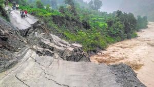 A road leading to Rasiyabad village washed away after heavy rainfall at Munsiyari in Pithoragarh district on Monday.(PTI) A road leading to Rasiyabad village washed away after heavy rainfall at Munsiyari in Pithoragarh district on Monday.(PTI)