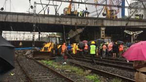 The bridge is part of the Gokhale bridge on SV Road that connects Andheri West to East. The collapse damaged the overhead wire structures, hampering train services on the western and suburban lines.(HT Photo)