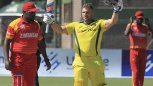 Australia batsman Aaron Finch celebrates scoring a century during the T20 match against Zimbabwe at Harare Sports Club on Tuesday.(AP) Australia batsman Aaron Finch celebrates scoring a century during the T20 match against Zimbabwe at Harare Sports Club on Tuesday.(AP)