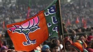Supporters wave a flag of the Bharatiya Janata Party (BJP) during a rally.(Reuters File)