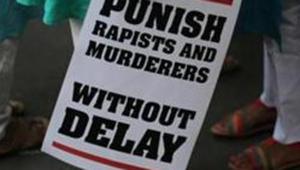 A protestor stands with a placard during a protest in New Delhi against two rape cases on Saturday, May 5, 2018 (Representative Photo)(AP File) A protestor stands with a placard during a protest in New Delhi against two rape cases on Saturday, May 5, 2018 (Representative Photo)(AP File)