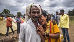 Sangeeta Bhosale mourns the death of her family members who were killed by mob on Sunday over suspicions of being child abductors at Rainpada village in Dhule, Maharashtra, on July 2, 2018.(Satish Bate/HT Photo) Sangeeta Bhosale mourns the death of her family members who were killed by mob on Sunday over suspicions of being child abductors at Rainpada village in Dhule, Maharashtra, on July 2, 2018.(Satish Bate/HT Photo)