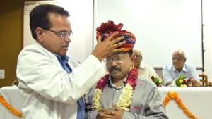 ENT head Dr.Manprakash Sharma felicitating Dr. Rajesh Vishwakarma, cochlear implant expert from Ahmadabad at SMS hospital in Jaipur on Wednesday.(Prabhakar Sharma/HT PHOTO)