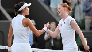 Belgium's Alison Van Uytvanck shakes hands with Spain's Garbine Muguruza after winning her Wimbledon second round match.(REUTERS) Belgium's Alison Van Uytvanck shakes hands with Spain's Garbine Muguruza after winning her Wimbledon second round match.(REUTERS)