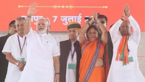 PM Narendra Modi, CM Vasundhara Raje and newly-appointed state BJP president Madanlal Saini greet people at Amrudon Ka Bagh in Jaipur on Saturday.(Himanshu Vyas/HT Photo) PM Narendra Modi, CM Vasundhara Raje and newly-appointed state BJP president Madanlal Saini greet people at Amrudon Ka Bagh in Jaipur on Saturday.(Himanshu Vyas/HT Photo)