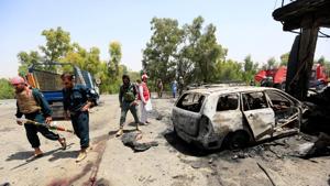 Afghan policemen inspect the site of a suicide attack in Jalalabad city, Afghanistan on Tuesday.(Reuters Photo) Afghan policemen inspect the site of a suicide attack in Jalalabad city, Afghanistan on Tuesday.(Reuters Photo)
