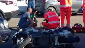 Ambulance personnel tend to a man lying on the ground, later identified as actor George Clooney, after being involved in a scooter accident in the near Olbia, on the Sardinia island, Italy.(AP) Ambulance personnel tend to a man lying on the ground, later identified as actor George Clooney, after being involved in a scooter accident in the near Olbia, on the Sardinia island, Italy.(AP)
