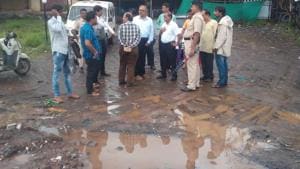 KDMC commissioner Govind Bodke visits the spot where a 26-year-old was crushed to death after his bike tripped over a pothole in Kalyan Gandhare, Mumbai, on Friday.(Rishikesh Choudhary/HT Photo) KDMC commissioner Govind Bodke visits the spot where a 26-year-old was crushed to death after his bike tripped over a pothole in Kalyan Gandhare, Mumbai, on Friday.(Rishikesh Choudhary/HT Photo)