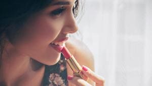 While doing makeup for the rainy season, opt for soft mattes, pink shades or soft browns instead of bold and bright reds.(Shutterstock) While doing makeup for the rainy season, opt for soft mattes, pink shades or soft browns instead of bold and bright reds.(Shutterstock)