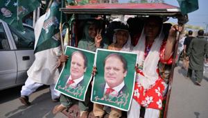 Supporters of ousted Pakistani prime minister Nawaz Sharif take part in a march towards the airport ahead of the arrival of Nawaz from London, in rally led by Shahbaz Sharif, Nawaz's younger brother and the head of Pakistan Muslim League-Nawaz (PML-L) party, in Lahore on July 13, 2018.(AFP) Supporters of ousted Pakistani prime minister Nawaz Sharif take part in a march towards the airport ahead of the arrival of Nawaz from London, in rally led by Shahbaz Sharif, Nawaz's younger brother and the head of Pakistan Muslim League-Nawaz (PML-L) party, in Lahore on July 13, 2018.(AFP)