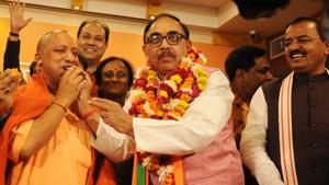 Uttar Pradesh BJP state president Mahendra Nath Pandey offering sweets to Chief Minister Yogi Adityanath after winning in UP Civic Polls in Lucknow.(HT File Photo) Uttar Pradesh BJP state president Mahendra Nath Pandey offering sweets to Chief Minister Yogi Adityanath after winning in UP Civic Polls in Lucknow.(HT File Photo)