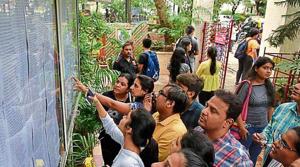 Students checking the first merit list at HR college in Churchgate last week.(Kunal Patil/HT Photo) Students checking the first merit list at HR college in Churchgate last week.(Kunal Patil/HT Photo)