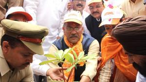 Chief minister Trivendra Singh Rawat plants a sapling to save Kosi river on Monday.(HT Photo) Chief minister Trivendra Singh Rawat plants a sapling to save Kosi river on Monday.(HT Photo)