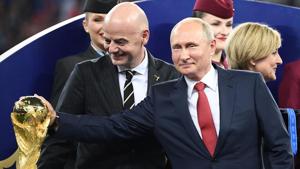 FIFA president Gianni Infantino watches as Russian President Vladimir Putin (R) touches the World Cup trophy during the Russia 2018 World Cup final football match between France and Croatia in Moscow on July 15, 2018.(AFP) FIFA president Gianni Infantino watches as Russian President Vladimir Putin (R) touches the World Cup trophy during the Russia 2018 World Cup final football match between France and Croatia in Moscow on July 15, 2018.(AFP)