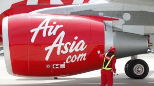 An AirAsia Japan Co engineer looks at an engine of the company's first Airbus SAS A320 aircraft.(Kiyoshi Ota/Bloomberg) An AirAsia Japan Co engineer looks at an engine of the company's first Airbus SAS A320 aircraft.(Kiyoshi Ota/Bloomberg)