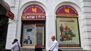 People walk past Punjab National Bank's Brady House branch in Mumbai on June 14.(REUTERS) People walk past Punjab National Bank's Brady House branch in Mumbai on June 14.(REUTERS)