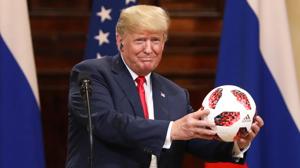 US President Donald Trump, receives a soccer ball from Vladimir Putin, Russia's president, during a news conference in Helsinki, Finland. Trump called Special Counsel Robert Mueller's probe into Russian election meddling a US President Donald Trump, receives a soccer ball from Vladimir Putin, Russia's president, during a news conference in Helsinki, Finland. Trump called Special Counsel Robert Mueller's probe into Russian election meddling a
