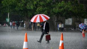 A man walking with umbrella during rains at Ridge, Shimla.(Deepak Sansta / HT Photo) A man walking with umbrella during rains at Ridge, Shimla.(Deepak Sansta / HT Photo)