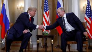 US President Donald Trump and Russia's President Vladimir Putin shake hands as they meet in Helsinki, Finland.(REUTERS) US President Donald Trump and Russia's President Vladimir Putin shake hands as they meet in Helsinki, Finland.(REUTERS)