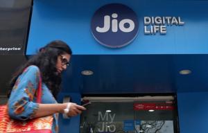 A woman checks her mobile phone as she walks past a mobile store of Reliance Industries' Jio telecoms unit, in Mumbai.(Reuters File Photo) A woman checks her mobile phone as she walks past a mobile store of Reliance Industries' Jio telecoms unit, in Mumbai.(Reuters File Photo)